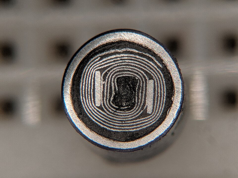 Figure 7 — Cutaway of a wound aluminium electrolytic capacitor. The long spiral of etched foil and paper spacer explains both the high capacitance and the tens-of-nanohenries ESL and appreciable ES…