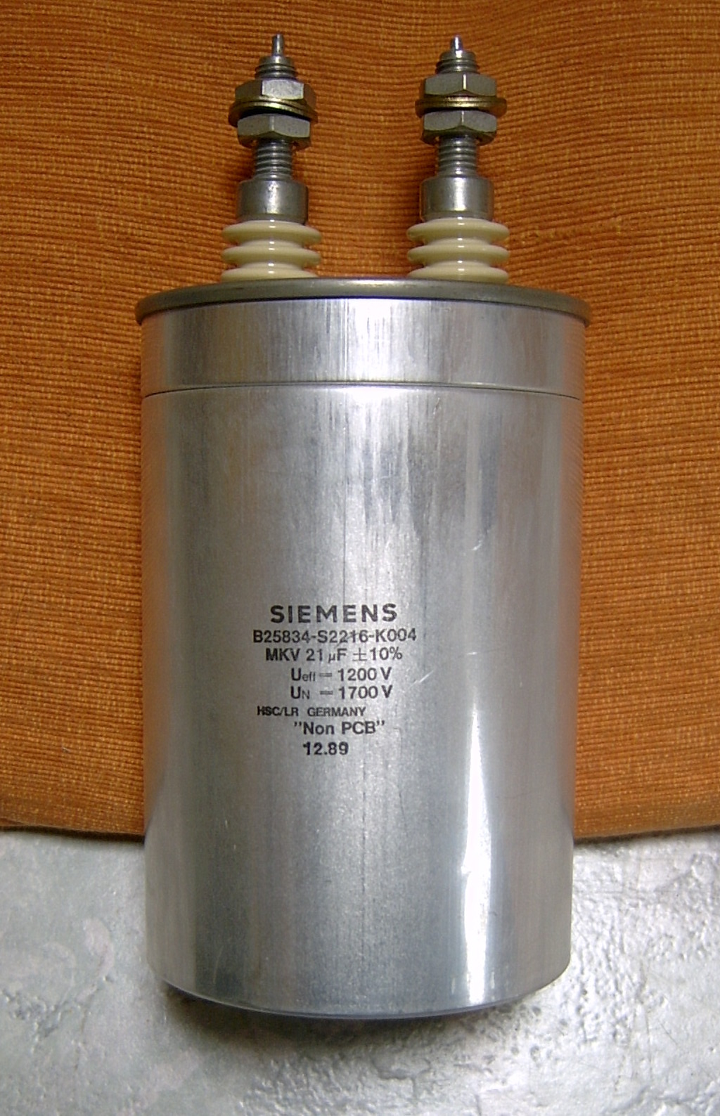 Figure 6 — A large cylindrical polypropylene AC power capacitor of the kind used in motor-run, power-factor, and mains-filtering duty, where PP's low loss and high current capability are essential.…