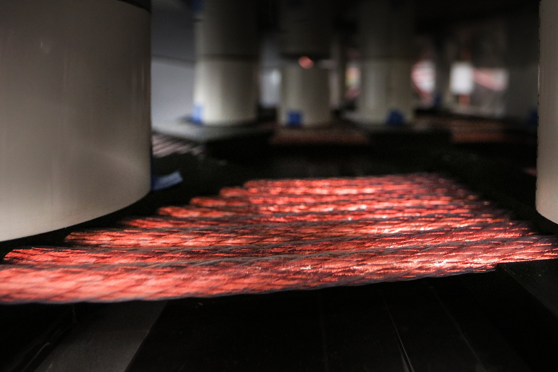 Figure 9 — A wireless-charging coil: a flat spiral of Litz wire that couples energy across an air gap to a matching coil in the device. Tuning both coils to resonance lets useful power cross the ga…