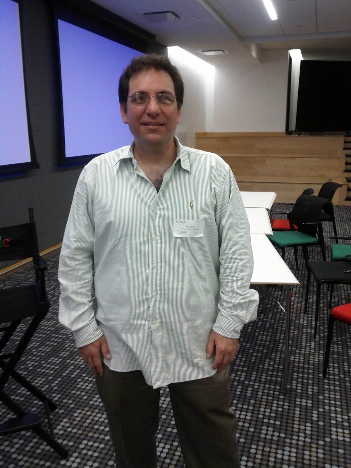 Figure 3 — Kevin Mitnick at Google, mid-2010s, after a book talk for Ghost in the Wires. Post-prison Mitnick built a successful security-consulting practice (Mitnick Security Consulting) and the consultancy K…