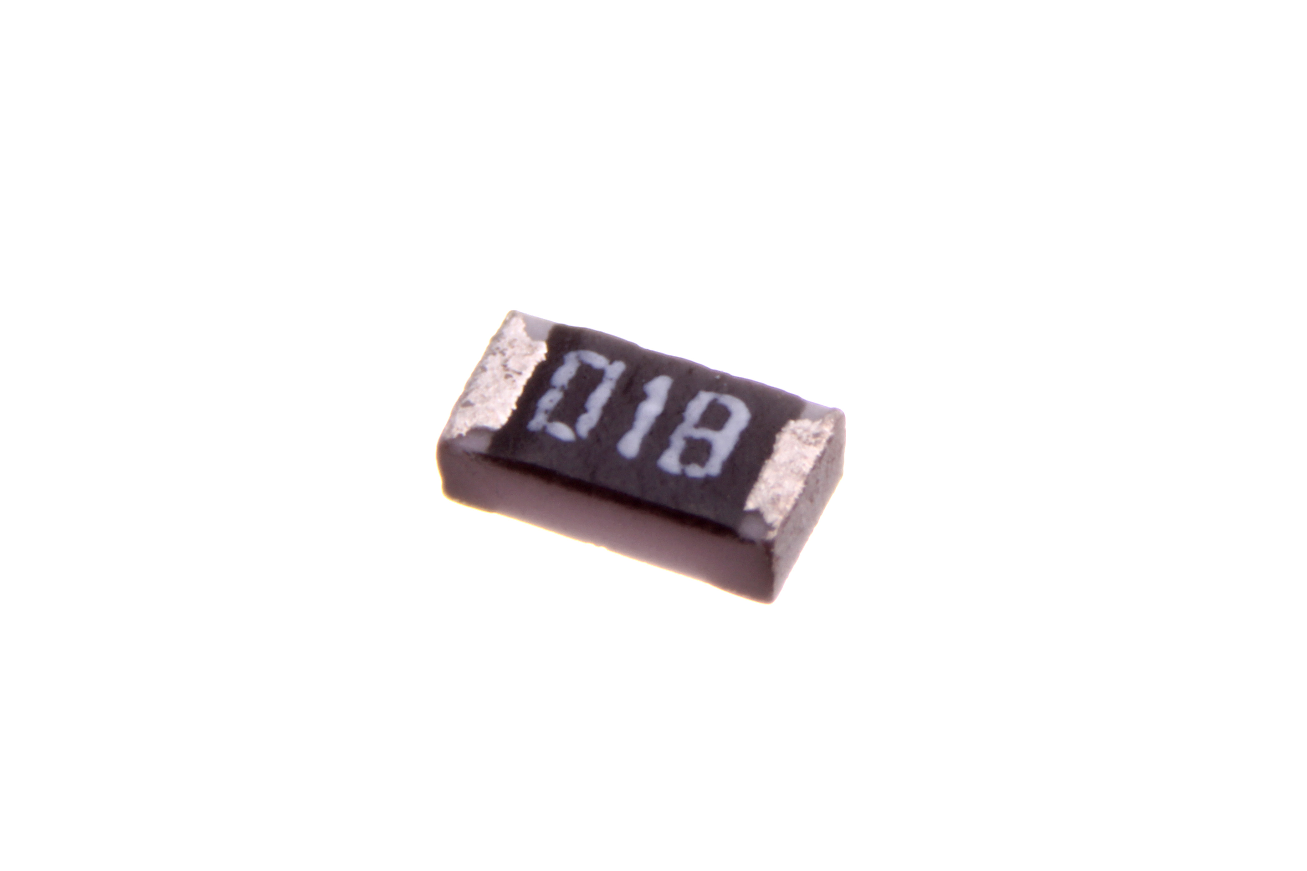 Figure 7 — A thick-film surface-mount chip resistor, an 0603 (1.6 × 0.8 mm) part marked "01B" — the EIA-96 code for 1 kΩ (value code 01 = 100, multiplier B = ×10). The black body is the fired glass…