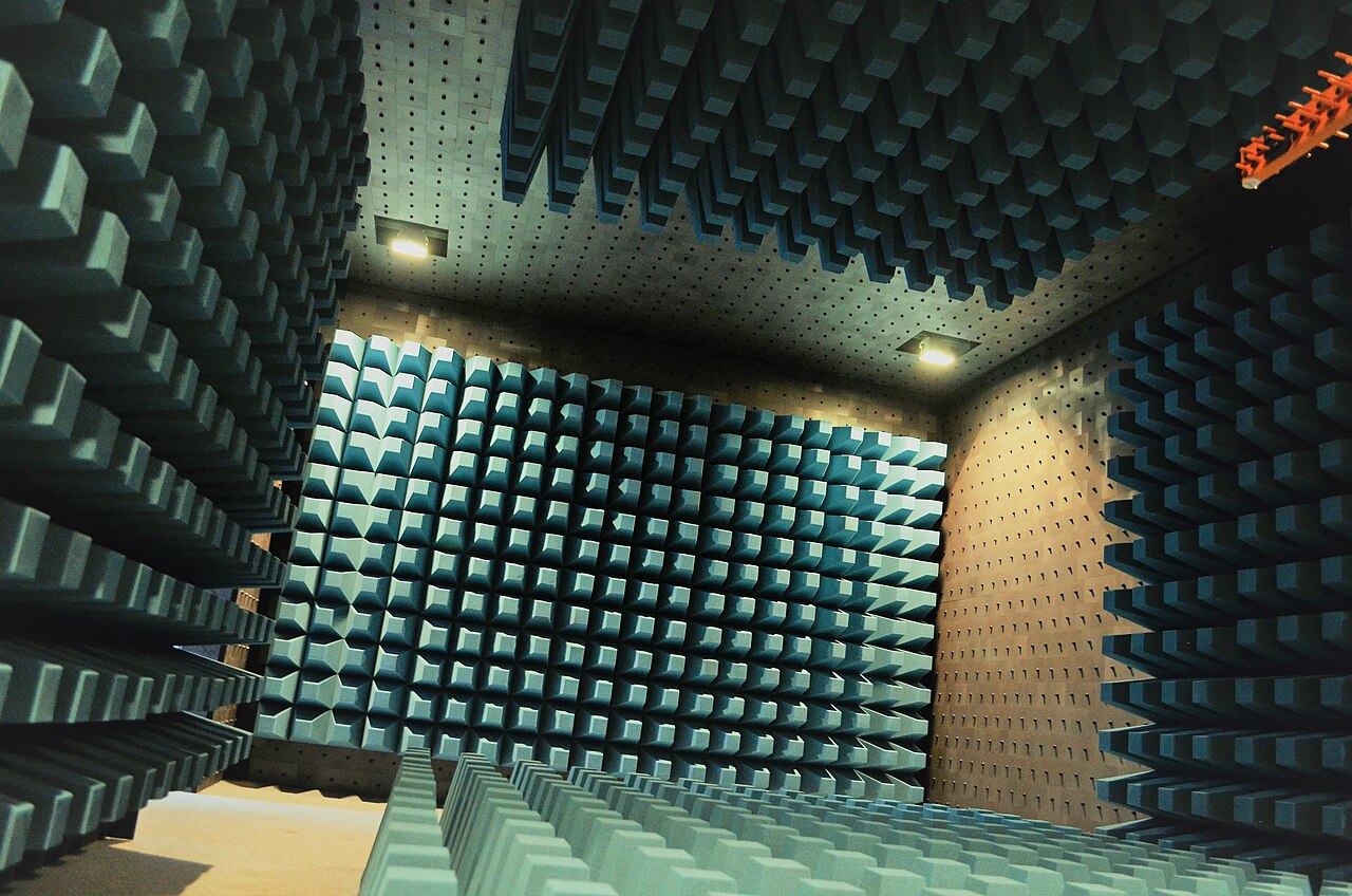 Figure 3 — Interior of a fully anechoic RF chamber. A TEMPEST-shielded SCIF borrows the same physics as an RF test chamber: a continuous conductive envelope, filtered penetrations, and controlled o…