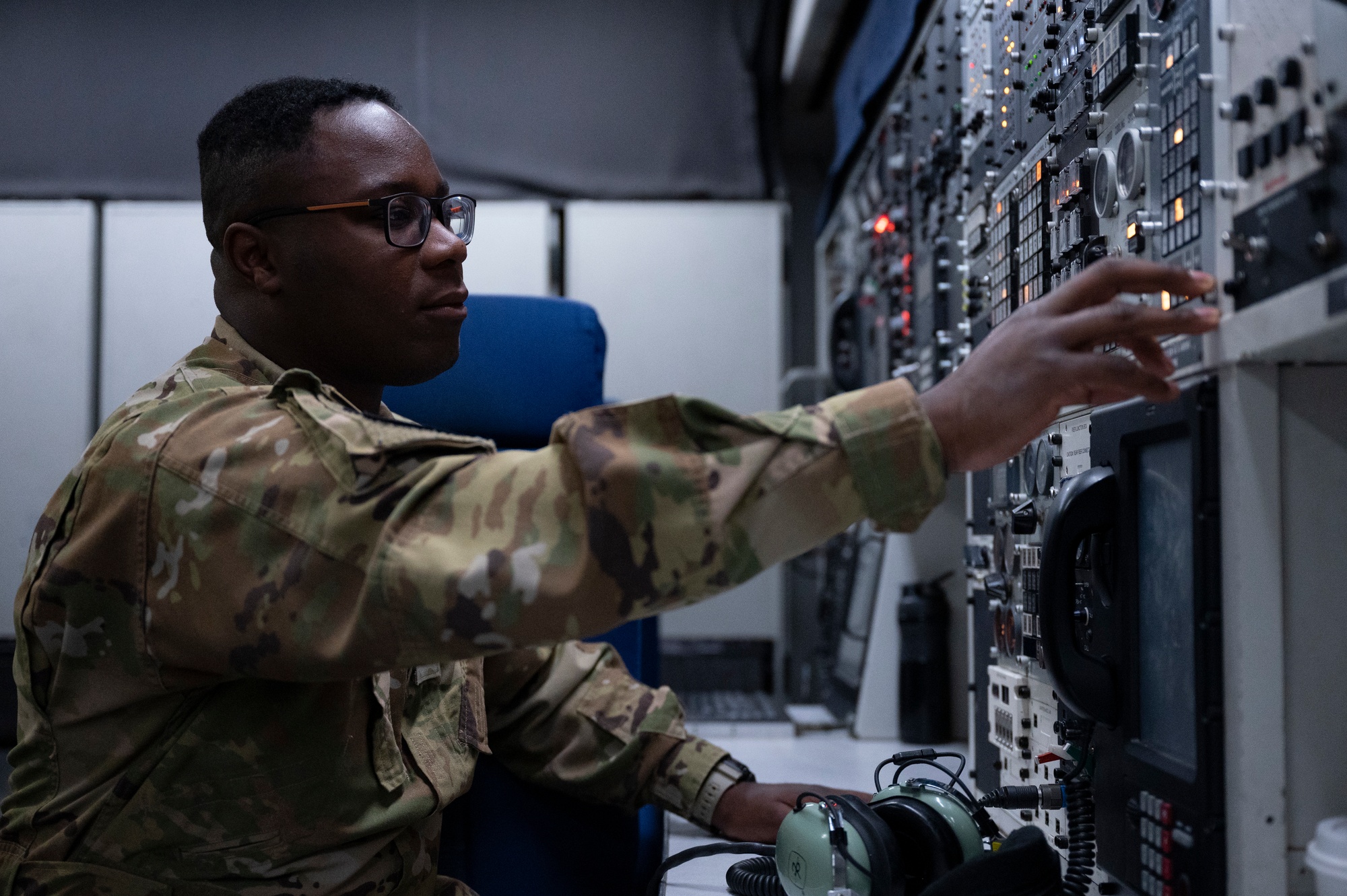 Figure 6 — Interior of the E-4B "Nightwatch" National Airborne Operations Center; an airman tends the environmental systems keeping the communications gear alive. The dense equipment racks are the …
