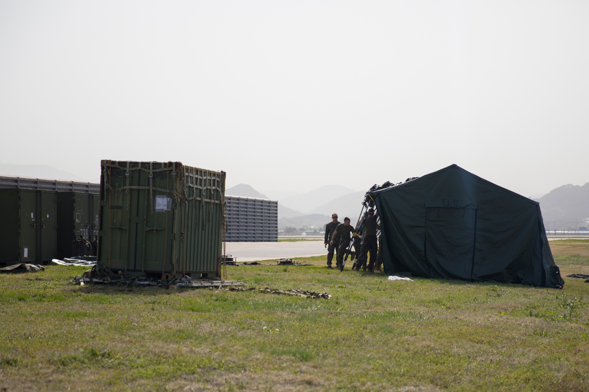 Figure 4 — U.S. Marines with Marine Aircraft Group 12 erect a tent for a temporary SCIF at Gwangju Air Base, Republic of Korea, during Korea Flying Training, April 2023. At the tactical edge, the "…