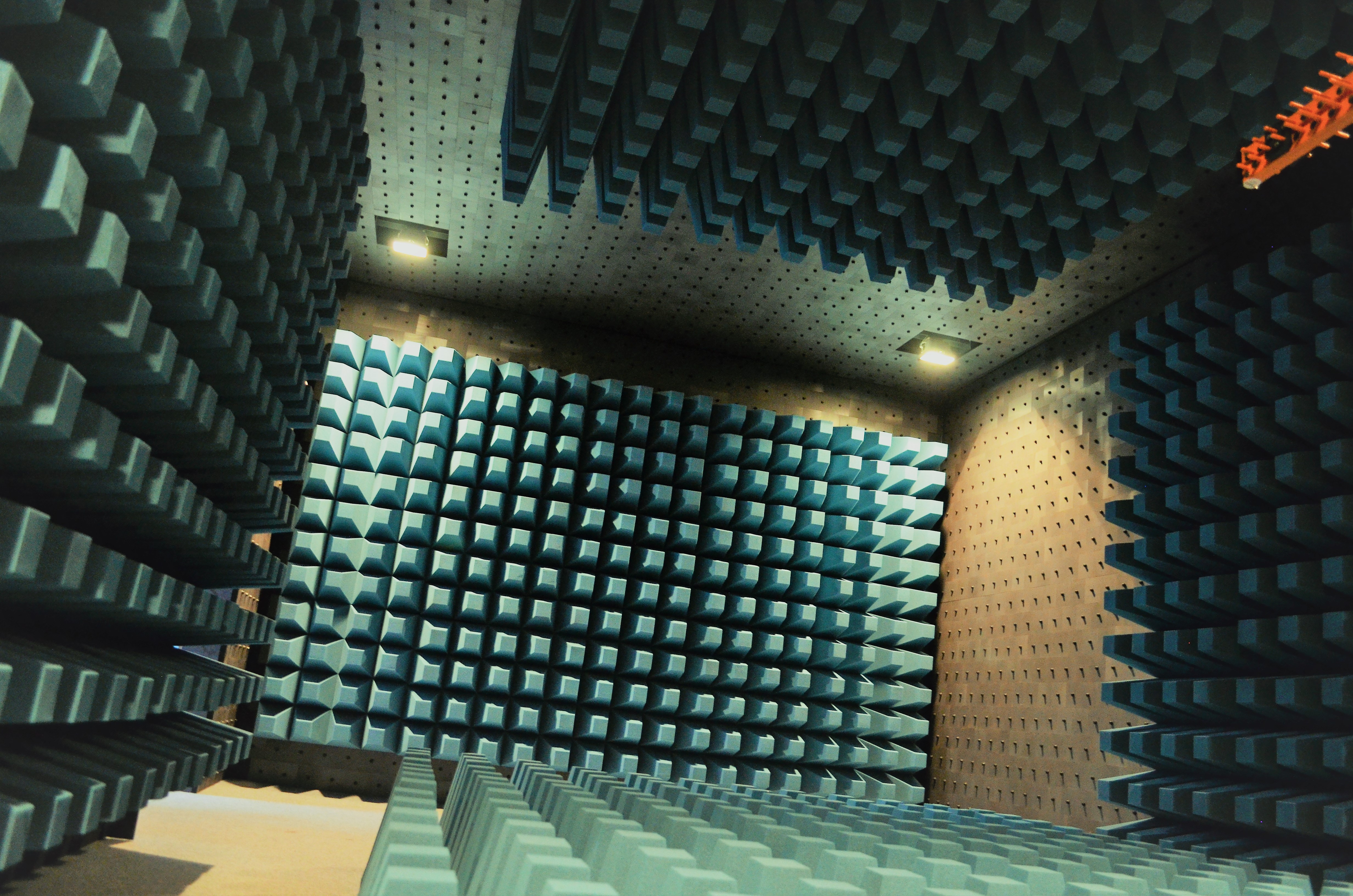 Figure 6 — The interior of an RF-tight, fully-anechoic shielded enclosure. The radiation-absorbent pyramids are an EMC-test refinement, but the box itself — a continuous metal shell with filtered p…