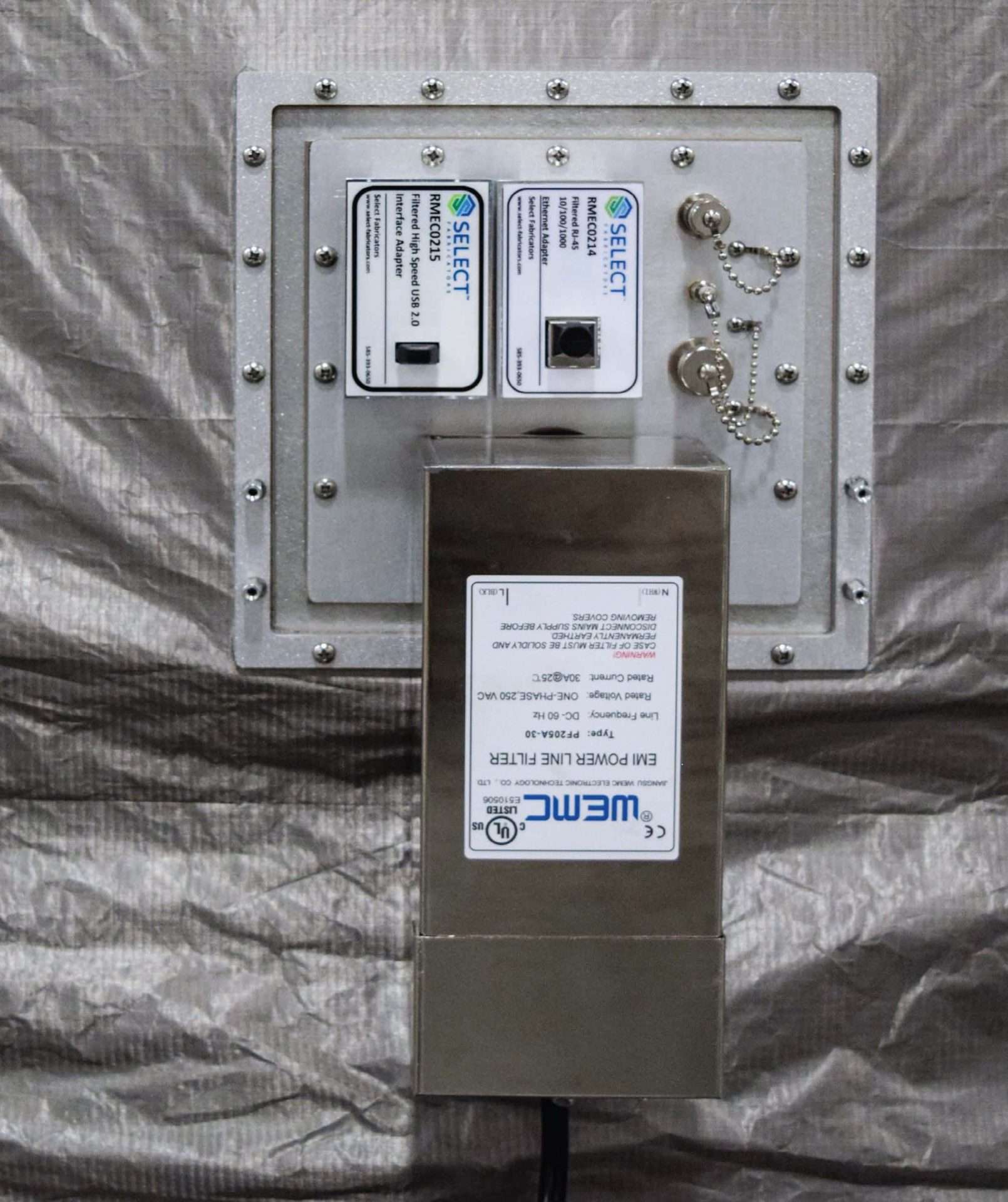 Figure 4 — An inflatable RF/EMI shielded tent — a deployable Faraday enclosure with a conductive fabric skin, gasketed door, and honeycomb air vents. This is the shielding industry's answer to "we …