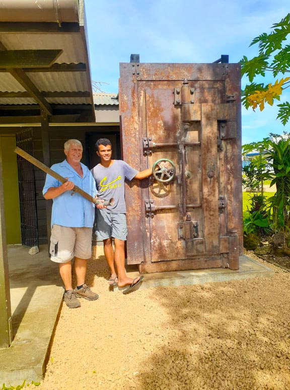 Figure 2 — Figure B — A GSA-approved vault door is a slab of hardened steel on a massive frame, closed by a hand-wheel that throws a set of boltwork into the jamb on multiple edges — the same architecture as …
