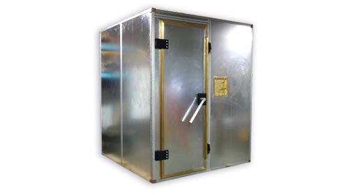 Figure 5 — A modular galvanized-steel shielded enclosure: prefabricated panels clamped on a frame, with a knife-edge/fingerstock door (the brass strip around the door frame is the fingerstock). Eve…