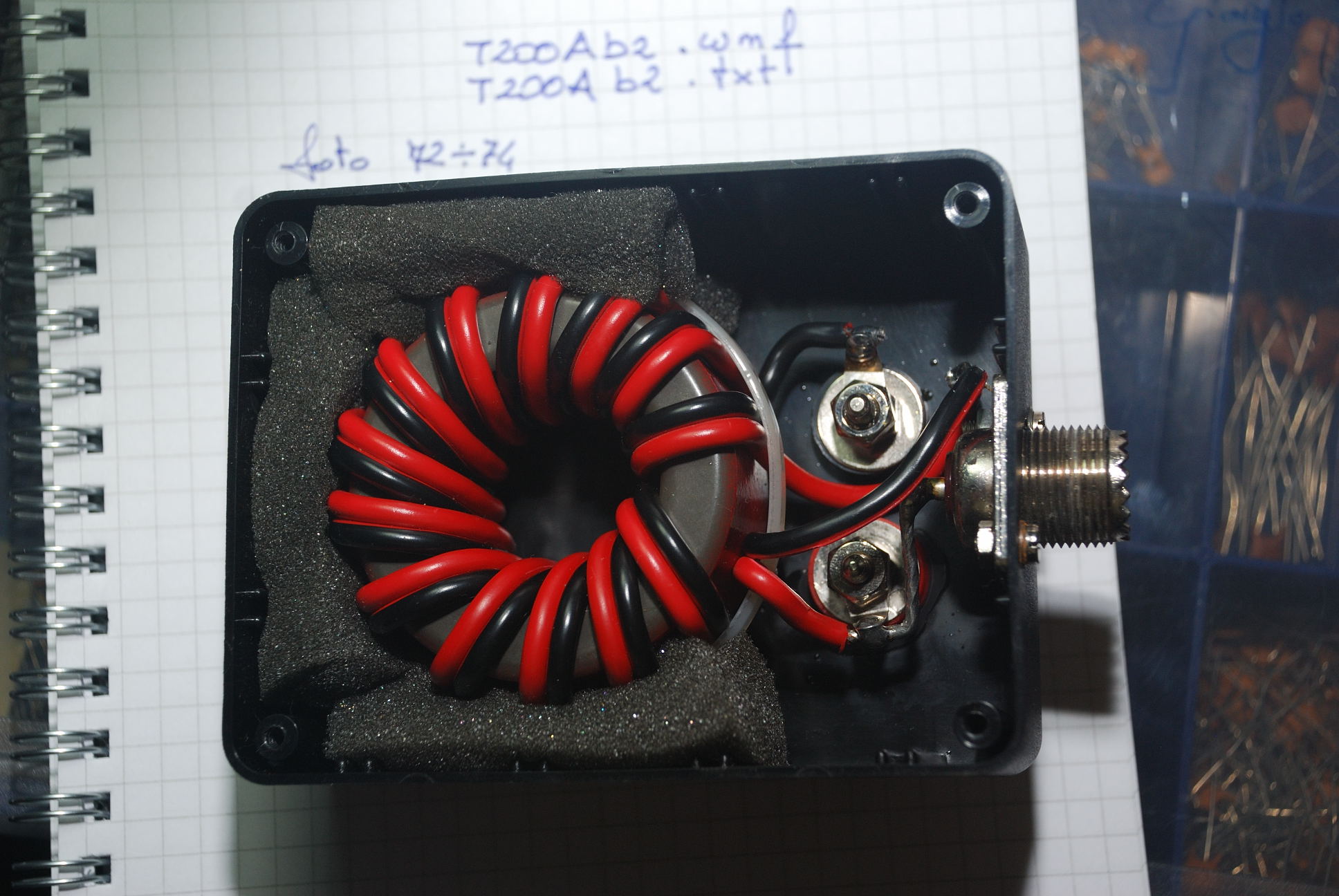 Figure 7 — A homemade 4:1 antenna balun, thirteen bifilar turns wound on a large type-2 powdered-iron toroid, of the kind this project builds. Source photo: "T200A2.jpg" (Balun 4:1, 13 turns on T20…