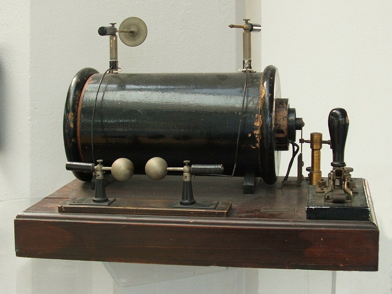 Figure 3 — A Ruhmkorff-type induction coil: a few-turn primary and a many-turn secondary on a common iron core, with the vibrating interrupter that chops the primary current and the terminals acros…