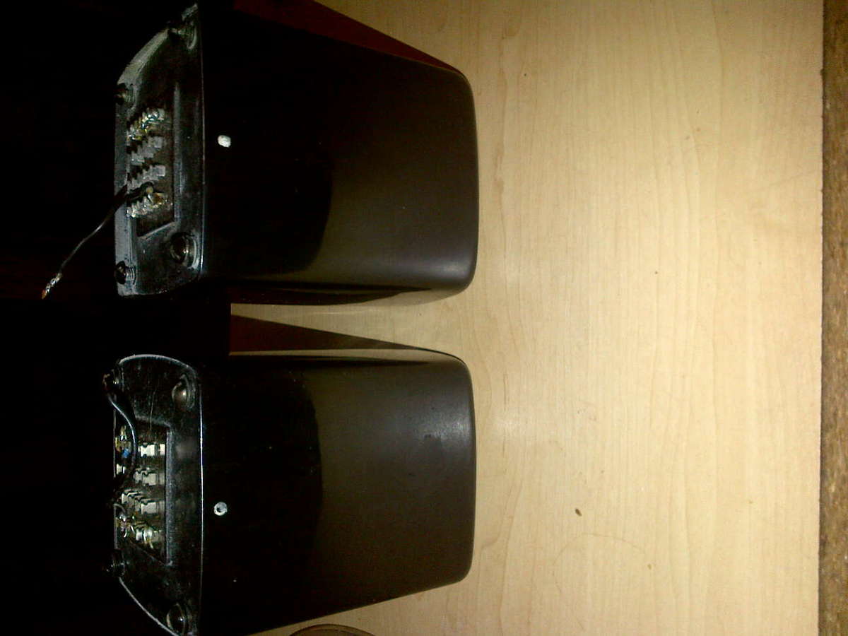 Figure 7 — A pair of valve-amplifier output transformers, potted in cans with their secondary and primary tags brought out at the base. The output transformer is often the largest, heaviest, and mo…